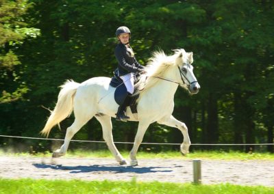 Amelie Riding a Horse | Vermont Icelandic Horse Farm & Lodging in Waitsfield